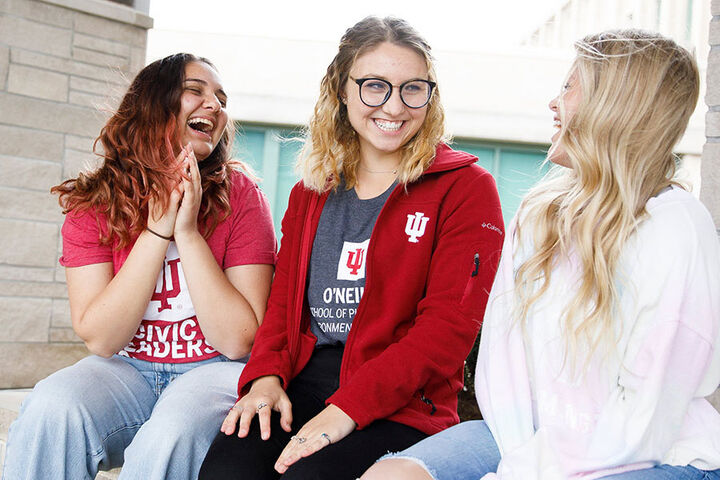 Three female students wearing SPEA shirts.